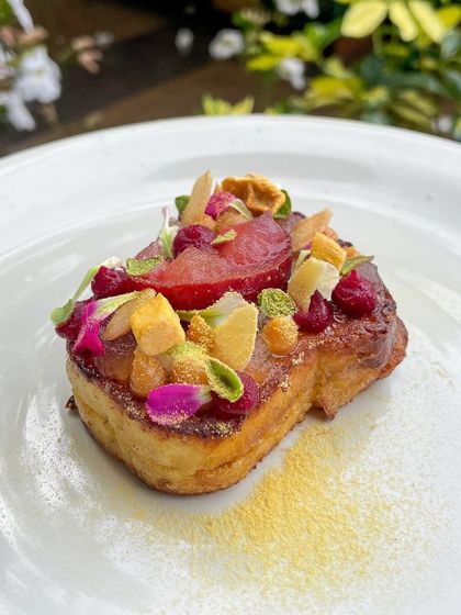 A beautiful slice of Pain Perdu, or French toast, made with my homemade brioche and topped with stewed plums and freeze-dried mango.