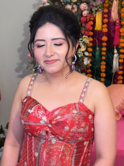 A close-up of Rashmi's Mehendi makeup. The soft pink tones on her eyes and lips create a look that is pretty and romantic.