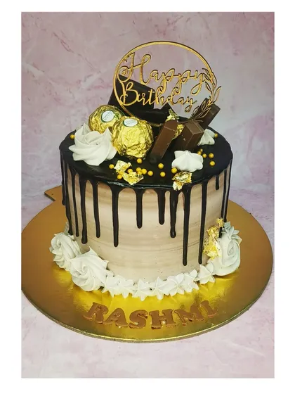 Back to basics with this chocolate overloaded Ferrero Rocher cake. The rich chocolate drip and golden chocolates make it an indulgent treat.