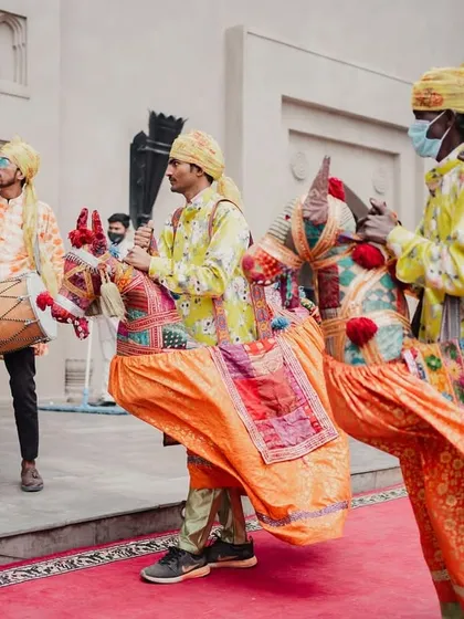 A traditional welcome with Kachhi Ghodi dancers and dhol players at the entrance of the Fairmont Jaipur, giving guests an authentic Rajasthani experience.
