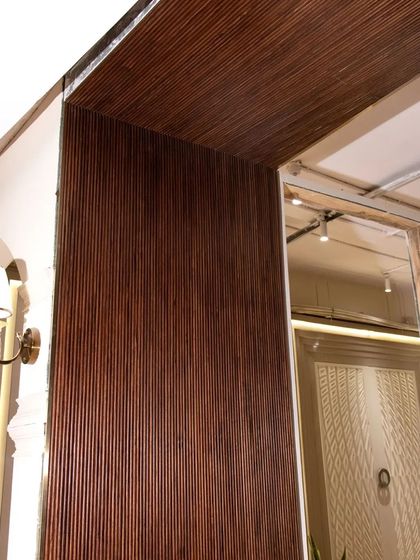 Another example of the deep texture veneer, this time used to wrap around a corner. The fluted pattern catches the light and adds a sense of drama.