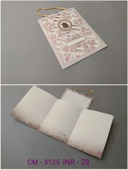 This handled invitation card features delicate laser-cut floral patterns on a soft pink background. The collage shows the exterior and the blank tri-fold insert ready for your message.