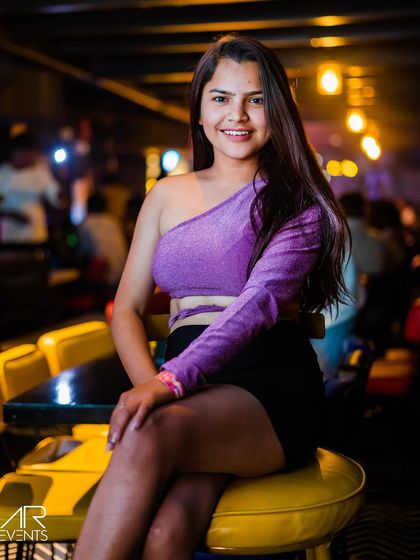 A guest posing at the bar.