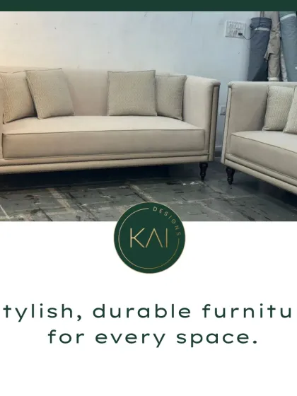 This sofa set features classic nailhead trim and a neutral fabric, offering a timeless and elegant seating solution. The design is versatile, suitable for both formal and casual living spaces.