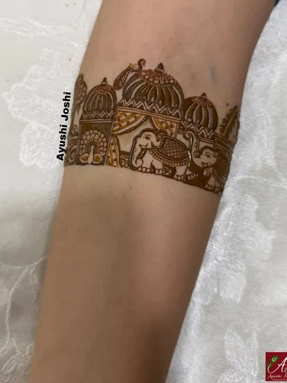 Another armband idea featuring a procession of elephants in front of a palace.