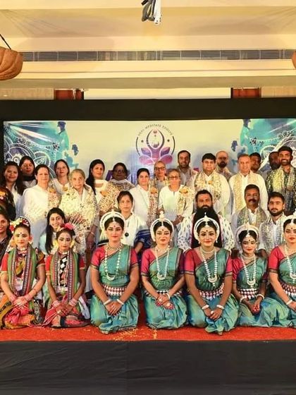 Our entire group with the talented Odissi dancers after their performance. This photo captures the beautiful blend of spirituality and cultural appreciation on our Puri Yatra.