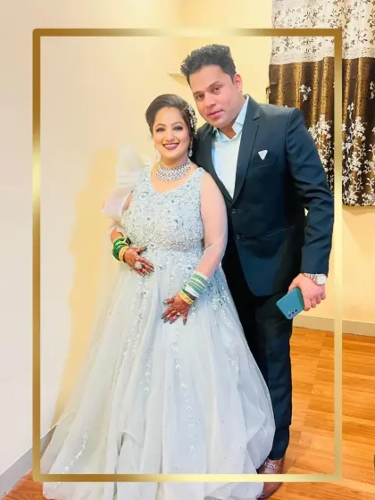 Another shot of the lovely couple. Her sparkling ice blue gown is the star of the show, perfect for a glamorous reception.