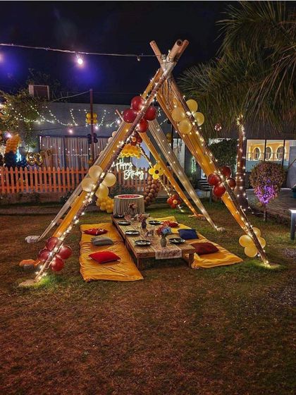 My cabana setups are perfect for any open area, like a lawn or garden. This image shows a wider view of the tent structure, which can be customized with balloons and other decor to fit your celebration's theme.