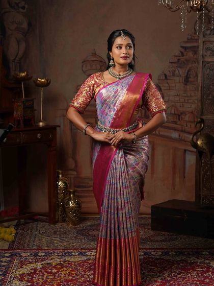 This is the result of a wonderful team effort. I draped this multi-color silk saree on Ramya, creating a graceful look with perfectly defined pleats that complement her makeup and hairstyle.