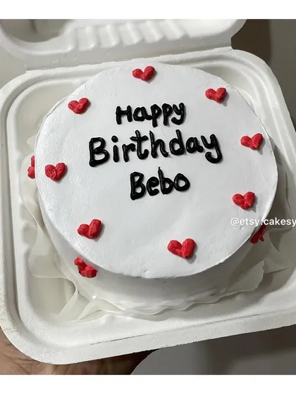 A sweet and simple birthday bento cake for 'Bebo', surrounded by little red hearts.