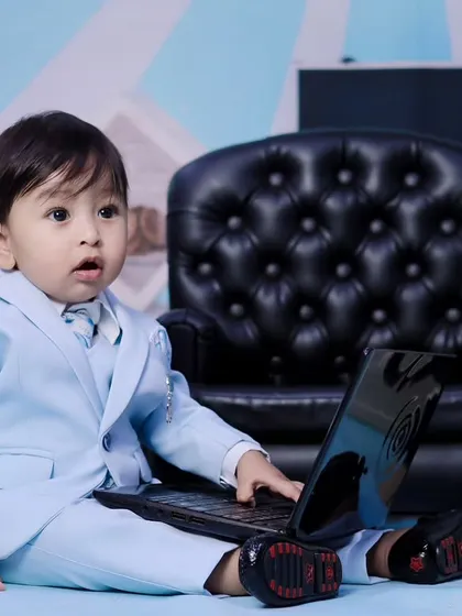 Another angle from our 'Boss Baby' shoot, showing the baby's focused expression.