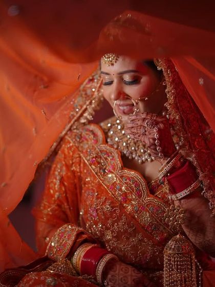 Another beautiful shot with the veil, creating a sense of mystery and elegance around the bride.