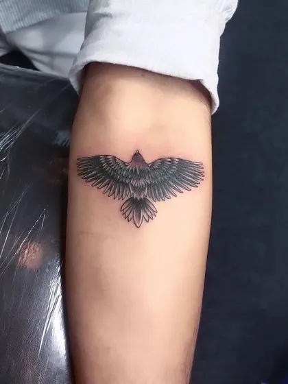 We covered a scar with this bold eagle tattoo. The solid blackwork and detailed feathers provide excellent coverage while creating a powerful new piece.