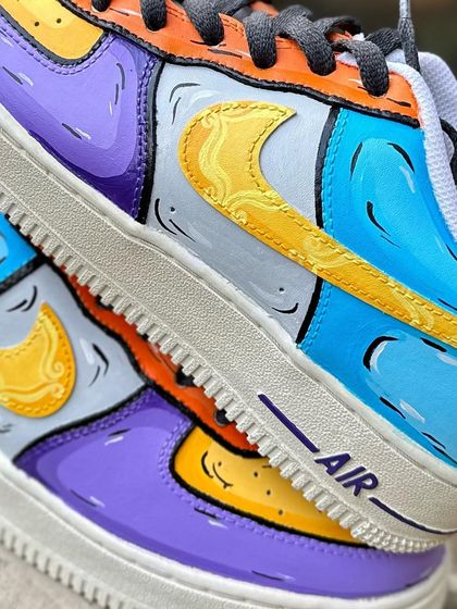 A macro shot of the swoosh on the Friends custom, which has a pattern inspired by the famous yellow frame on Monica's door.