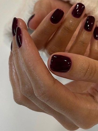 A deep, vampy burgundy that’s perfect for the colder months. This shade is dark, mysterious, and incredibly elegant, especially on these shorter, squared-off nails.