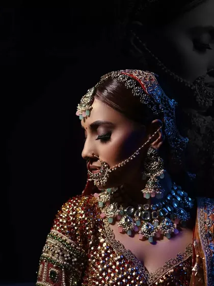 A creative double-exposure style portrait of the bride, blending a color image with a monochrome silhouette for an artistic effect.