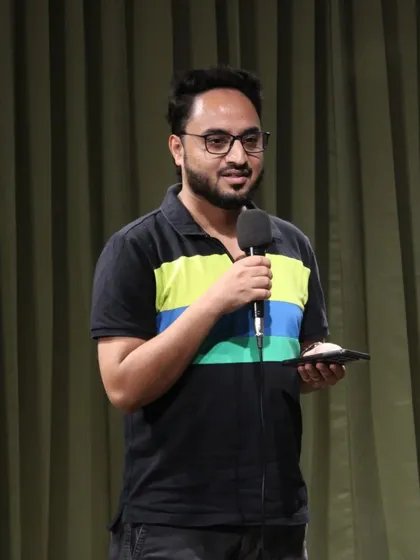A comedian engaging with the crowd during a fun-filled open mic night.