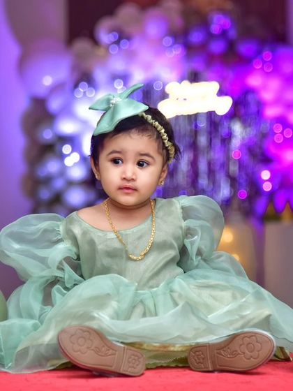 A magical 'Frozen 2' themed birthday party, transforming the venue into an enchanted forest with earthy tones, character cutouts, and shimmering backdrops.