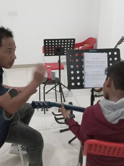 Another look at a one-on-one guitar lesson. Our instructors are patient and dedicated to helping each student succeed.