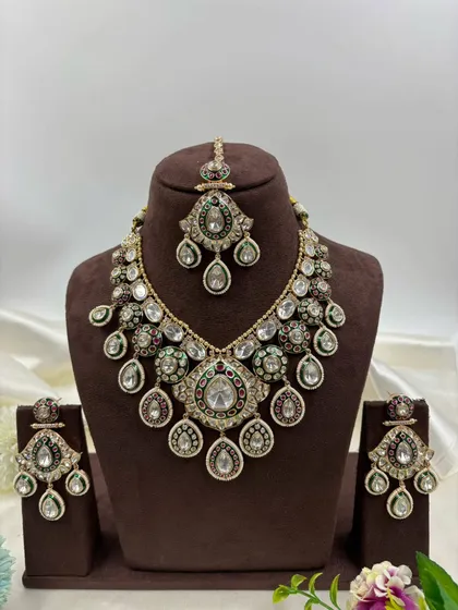 A unique bridal set with a mix of kundan work and colored stones, designed for a distinctive look.