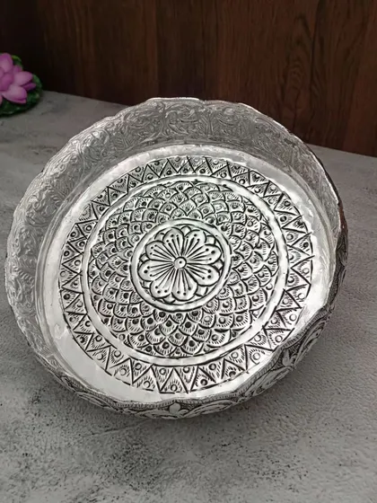 Another antique urli with a different, more intricate floral pattern, showcasing the variety in our craftsmanship.