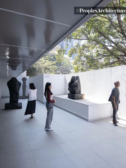 Visitors in the outdoor sculpture gallery at MAP. This space is designed as a threshold, a semi-open area that blurs the line between the street and the museum, making art accessible even before one enters the building.