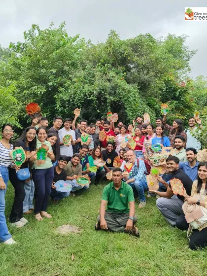 It's not all hard work! Here's the KPMG team showing off their creations after a leaf painting session. We mix our plantation drives with creative nature activities to make the day memorable, fun, and a true break from the office routine.