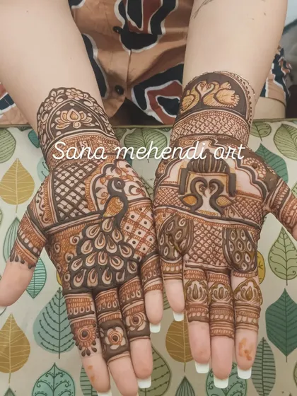 This design showcases different styles of peacock and swan motifs, from bold figures on the palm to delicate ones on the wrist.
