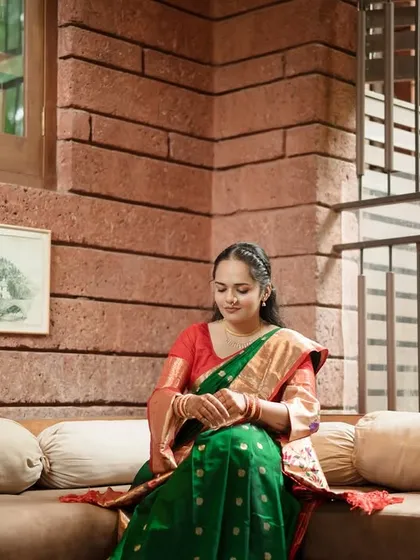 A quiet moment of reflection for the bride before the festivities begin. The calm setting and her serene posture create a peaceful and elegant portrait.