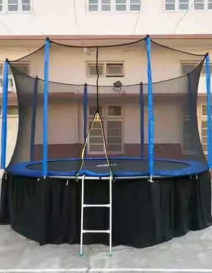 A sturdy, round trampoline complete with a full safety net and access ladder. I provide this for parties as a great alternative or addition to inflatables.