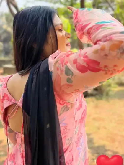 This photo shows the back detail of the organza kurta, which features a simple tie-up design. It's these little details that make a custom outfit feel special.