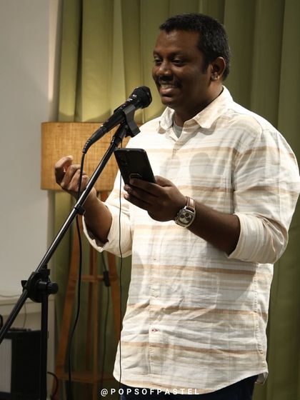 An artist shares a story, using hand gestures to bring it to life.