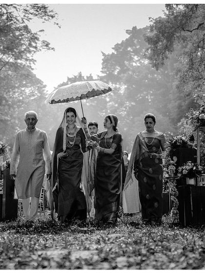 A grand bridal entry, captured in timeless black and white.