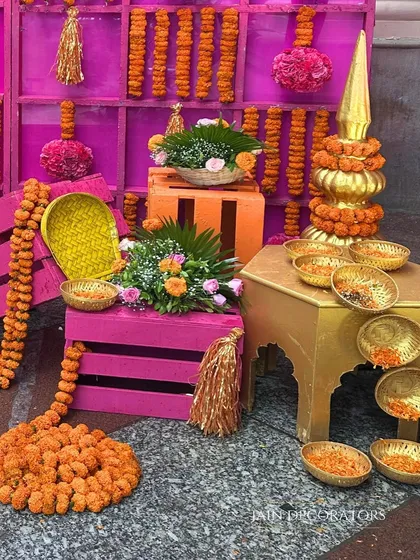 Traditional elements are the soul of a Haldi ceremony. I used colorful crates, brass vessels, and garlands of marigolds to create this vibrant corner for guests to participate in the rituals.