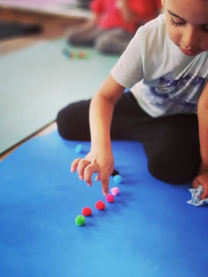 We use colorful pom-poms for focus and fine motor skill exercises. It's one of the many ways I make mindfulness and concentration feel like a game.