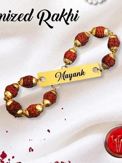 Our customized Rudraksha rakhi is a simple yet powerful way to show your love. We engrave any name you want on the polished metal plate, surrounded by authentic Rudraksha beads.