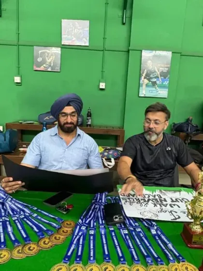 Preparing for the awards ceremony. Our coaches are organizing the medals and trophies for the summer camp's internal tournament.