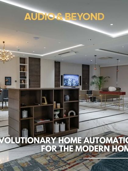 This wide shot of my showroom floor demonstrates my vision for revolutionary home automation in the modern home. It features an open-concept living and dining area with integrated smart technology and a pop-up TV console.