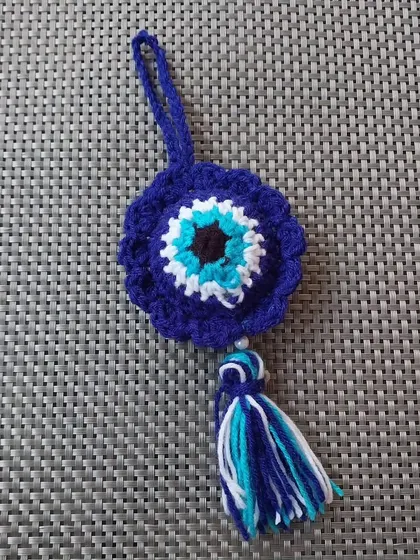 This version of the evil eye charm comes with a loop, making it perfect as a car hanging or a bag charm.