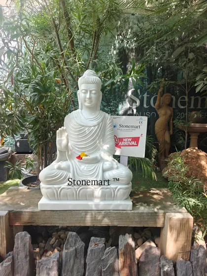 Another view of our 3-foot, 180 kg white marble Buddha statue. The fine details in the robes and facial expression are a testament to the skill of our carvers.