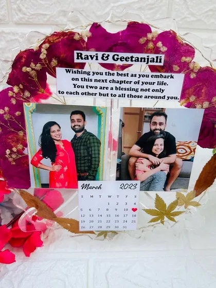 An angled view of the unlit frame, highlighting the custom message and calendar detail.