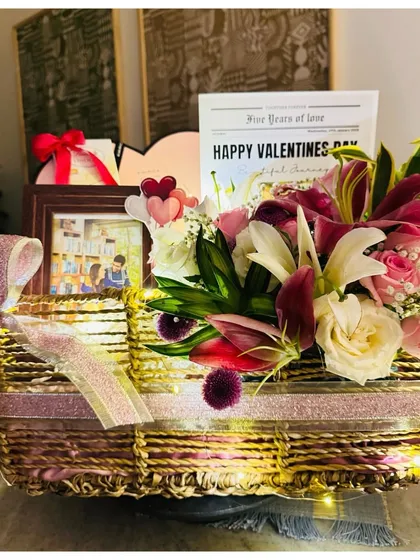 The Valentine's hamper for her, illuminated with fairy lights, creating a romantic and magical glow.