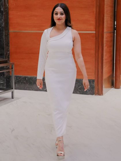 A chic and professional look for a corporate event. My wardrobe is as versatile as my hosting style, with outfits perfect for any formal occasion.