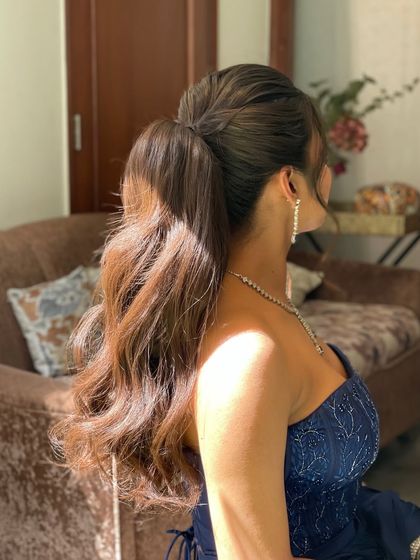 Another angle of the wavy ponytail, showing the texture and body I create using extensions and styling tools.