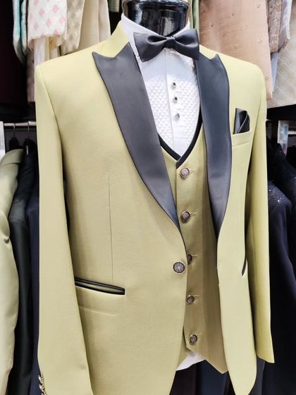 A collection of our designer suits, showcasing a variety of colors, fabrics, and custom details like embroidery, unique lapels, and accessories. Each piece is crafted to make a lasting impression.