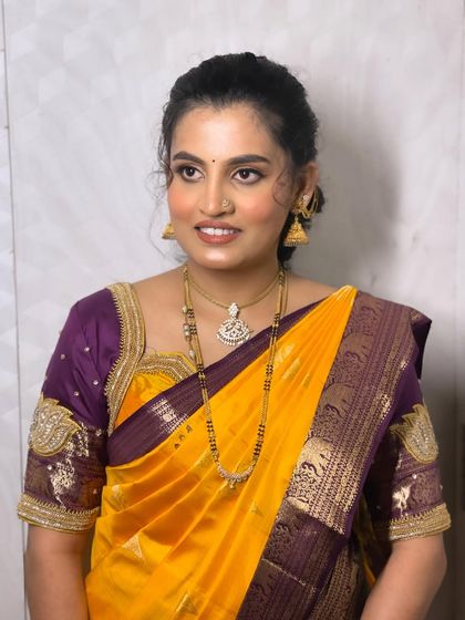 A beautiful still photo of Sushmitha, capturing the elegance of her traditional attire and the flawless finish of her HD makeup.