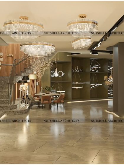 We designed the showroom with distinct zones to display different styles of lighting. This area features a grand staircase and showcases a range of contemporary and classic chandeliers and pendant lights.
