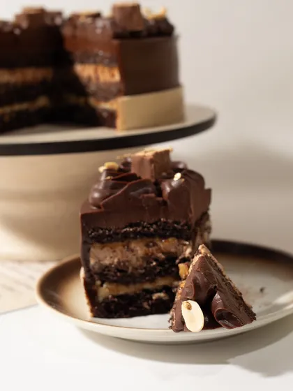 Just look at those layers. Taking a bite of my Snickers cake is an experience in texture and flavor, with the perfect balance of sweet, salty, and nutty.
