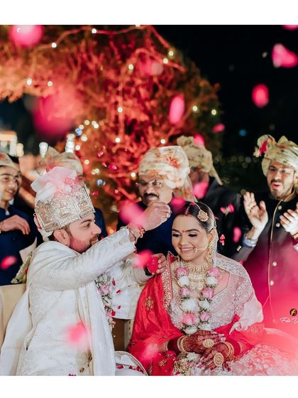 A shower of rose petals for Lakshay and Shweta. We love capturing these moments of celebration and blessing from family and friends during the wedding ceremony.
