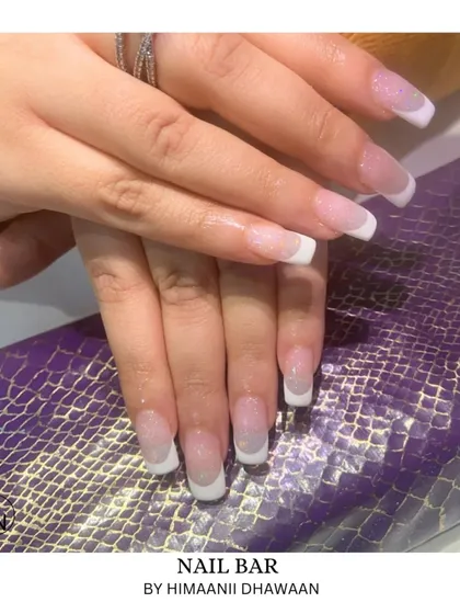 You can never go wrong with a classic. Here is a perfect example of our clean and elegant French ombré on square-shaped acrylic extensions, a timeless look for any occasion.